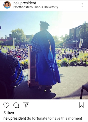 President Gibson wearing academic regalia addressing the attendees of her inauguration ceremony